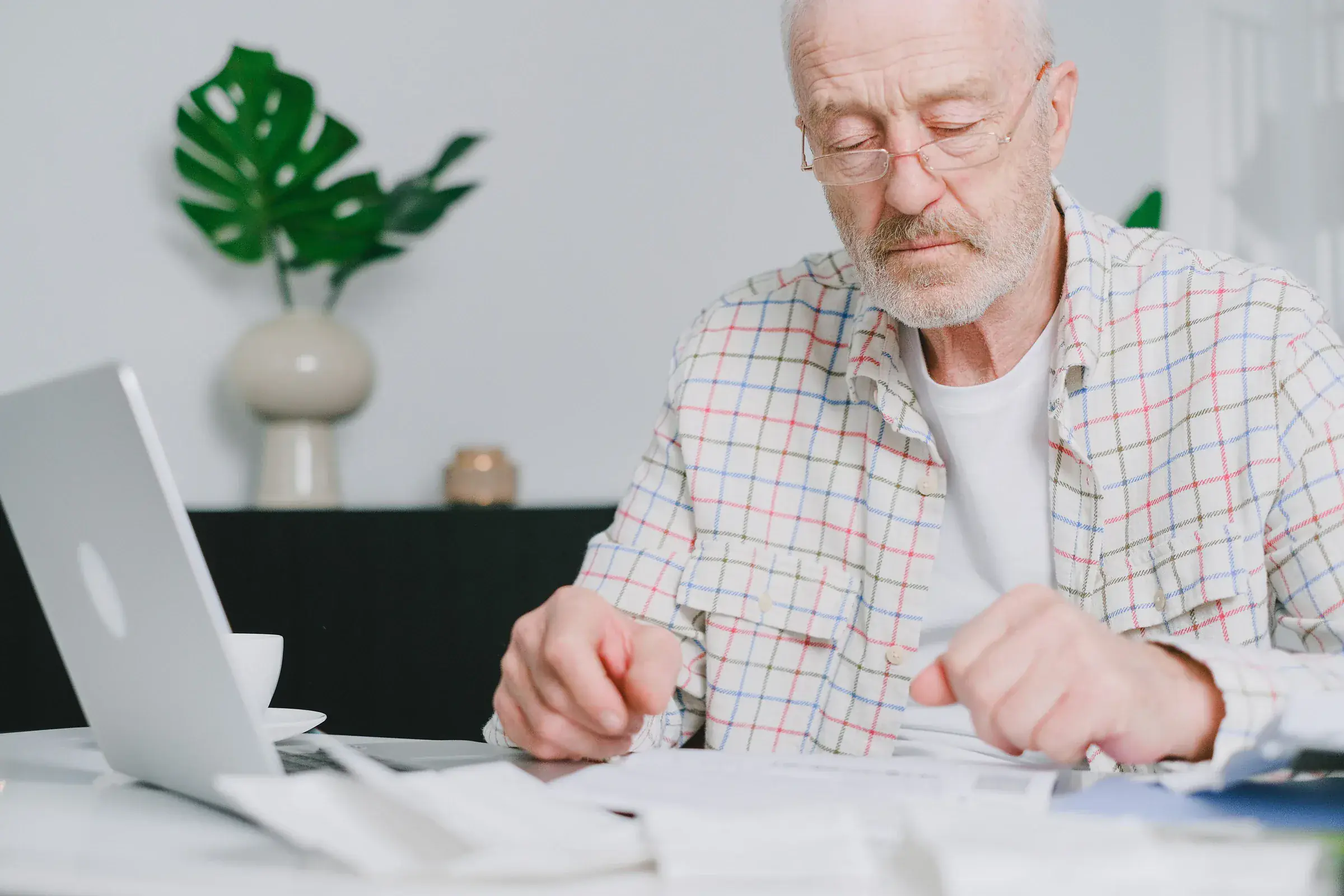 Older adult reviewing financial and estate documents